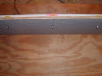 Radient Heat nest box - holes for water nipples in board- water nipples installed in board.JPG